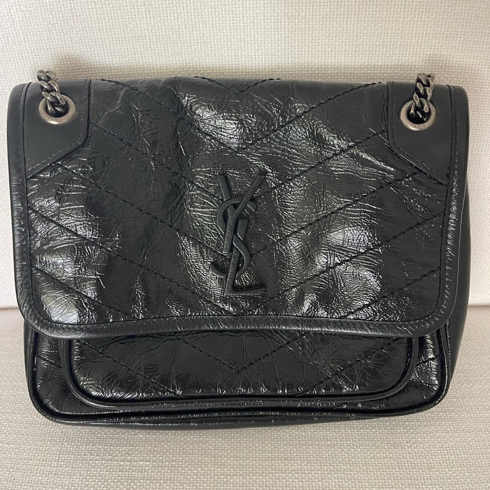 Saint Laurent Black Crinkled Calfskin Matelasse Monogram Baby Niki
$2,000.